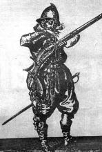 Dobový drevoryt zobrazuje mušketiera pripevňujúceho tlejúci knôt do čeľustí zámku svojej muškety